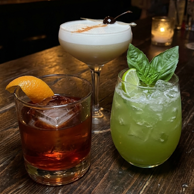 Craft cocktails on the dark bar at Goenchin