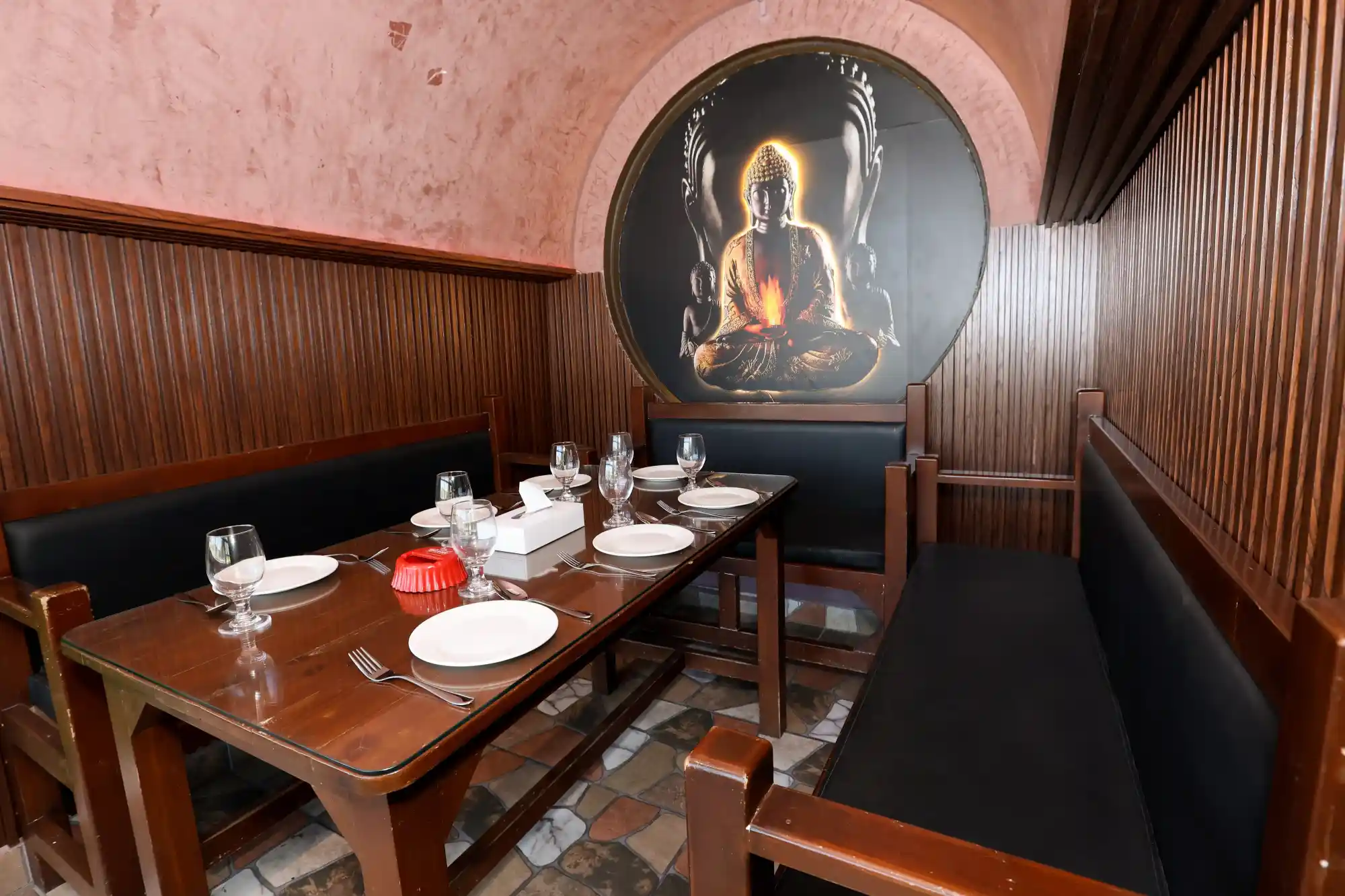 The intimate private dining alcove at Goenchin with its glowing Buddha artwork